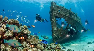 An underwater scene with scuba divers exploring a coral reef alongside colorful fish and a sunken ship. - Google Nano Banana Pro