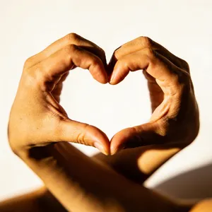 Two hands forming a heart shape together against a plain background. - Bytedance Seedream 4.5