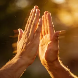 Two people high-fiving, with focus on their hands meeting mid-air. - Bytedance Seedream 4.5