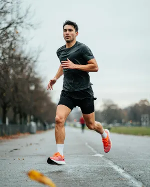 A runner mid-stride in a full-body action shot, limbs in motion and well-defined. - Ideogram Ideogram 4.0 (Quality)