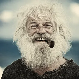 A 4K photo of an old fisherman with a weathered face and a pipe, grinning. - Krea Krea 2 Large