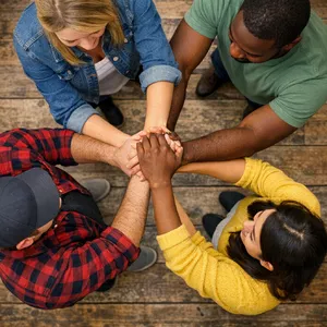 A group of five people joining hands in a circle, seen from above. - OpenAI GPT Image 1.5