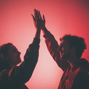 Two people high-fiving, with focus on their hands meeting mid-air. - Midjourney Midjourney V6.1