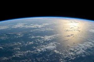 Photorealistic aerial photograph clearly showing the edge of the Earth from space, capturing realistic curvature, atmosphere, and sunlight reflections - XAI Grok Imagine 2.0 (Preview)